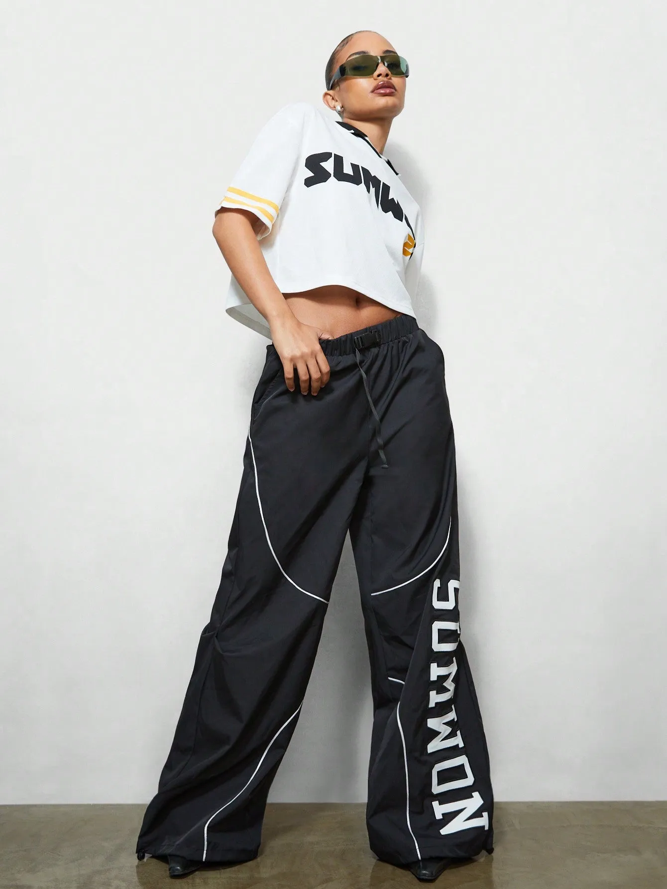 SUMWON WOMEN Loose Fit Baggy Nylon Joggers With Letter Applique And Piping Detail